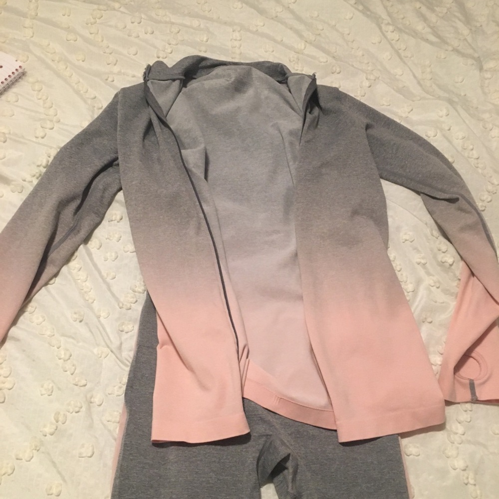 Pink and grey running jacket and leggings.